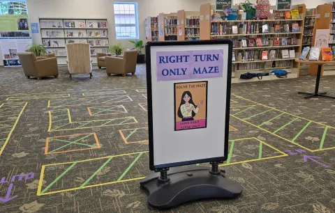 photo of the maze pattern taped out on the floor at the library